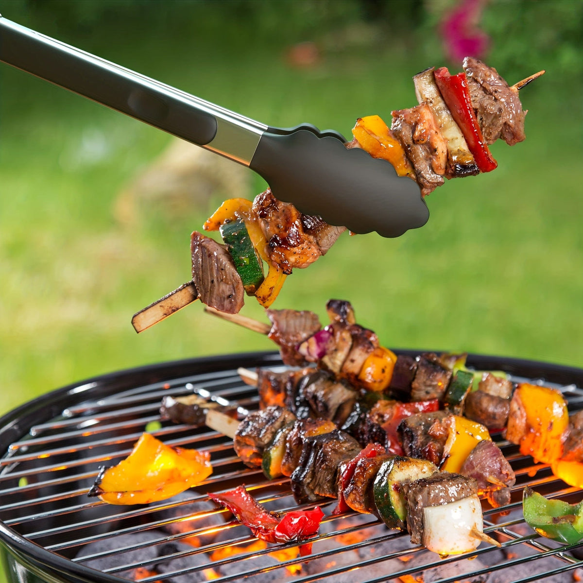 Kökszongler i rostfritt stål med svarta silikonspetsar