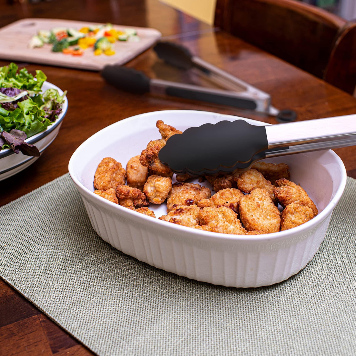 Kökszongler i rostfritt stål med svarta silikonspetsar